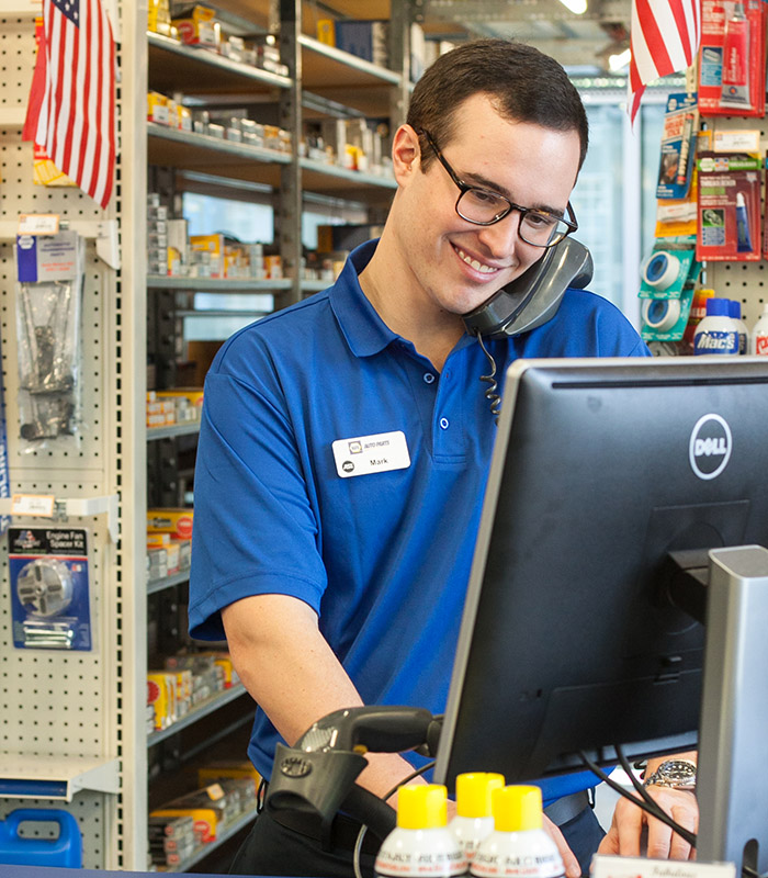 NAPA employee on phone